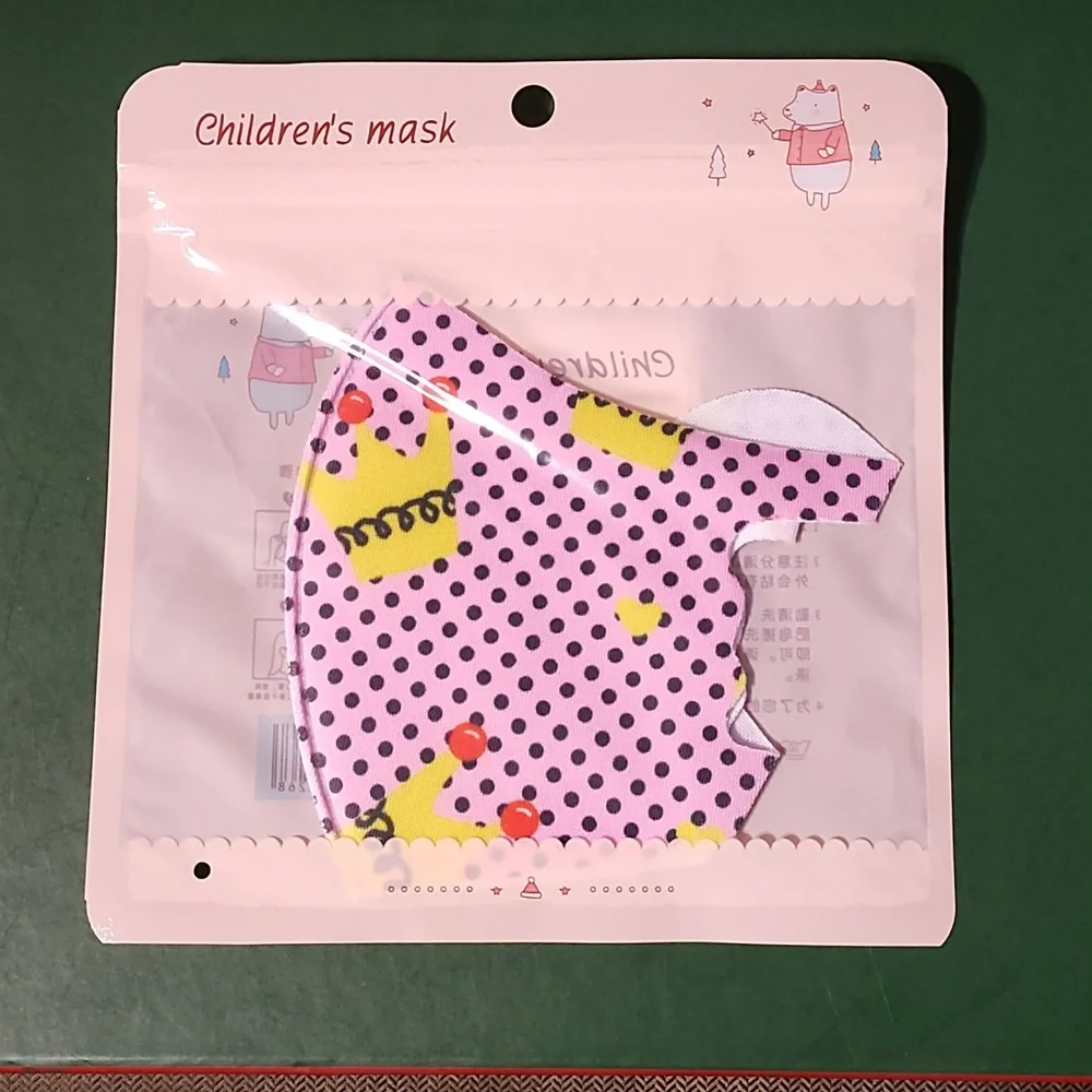 Children's re Usable face mask new in package never opened
